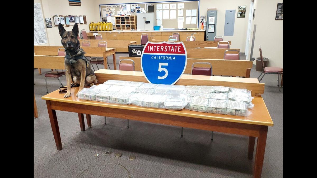 A driver and passenger were arrested after a California Highway Patrol officer and CHP K-9 Beny, located about $1,000,000 in cash during a traffic stop in Fresno County, according to the CHP. Authorities said the money was found after the K-9 alerted the officer to the odor of narcotics. Image courtesy California Highway Patrol.