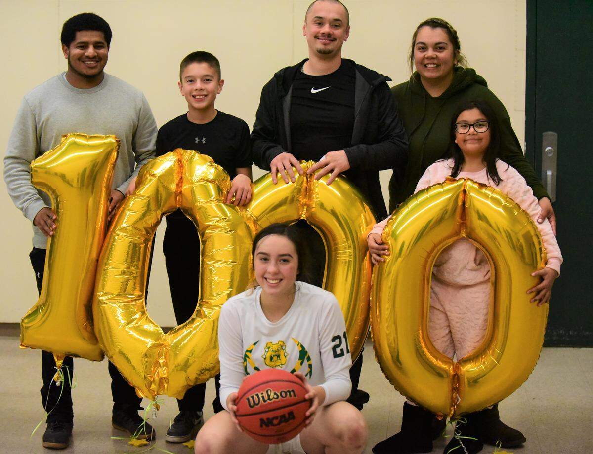Le Grand High junior Alexa Ulteras celebrates her milestone 1,000th career point on Friday, Dec. 13, 2019 with her coach Dannnon Graham (left), brother Diego, father Anselmo, mother Karina and sister Aryanna.