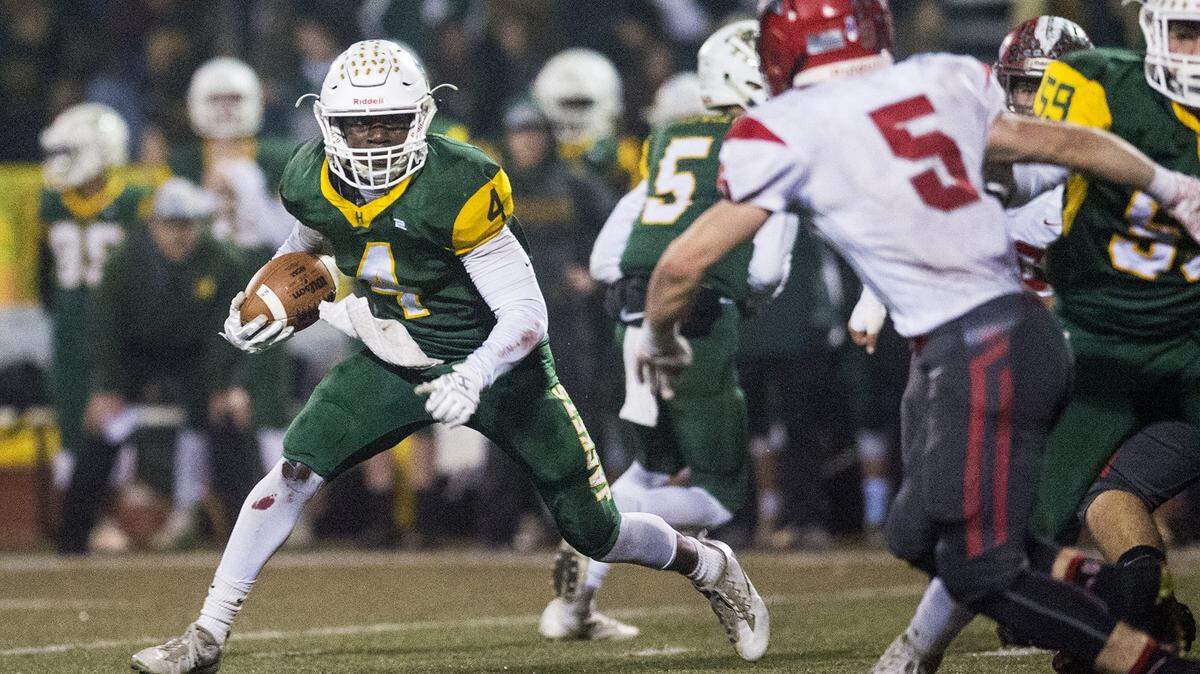 Hilmar senior Issac Sharp (4) rushes the ball during the Northern California 6-AA Championship game against East Nicolaus at Atwater High School in Atwater, Calif., on Friday, Dec. 7, 2018. The Yellowjackets beat the Spartans 48-14.