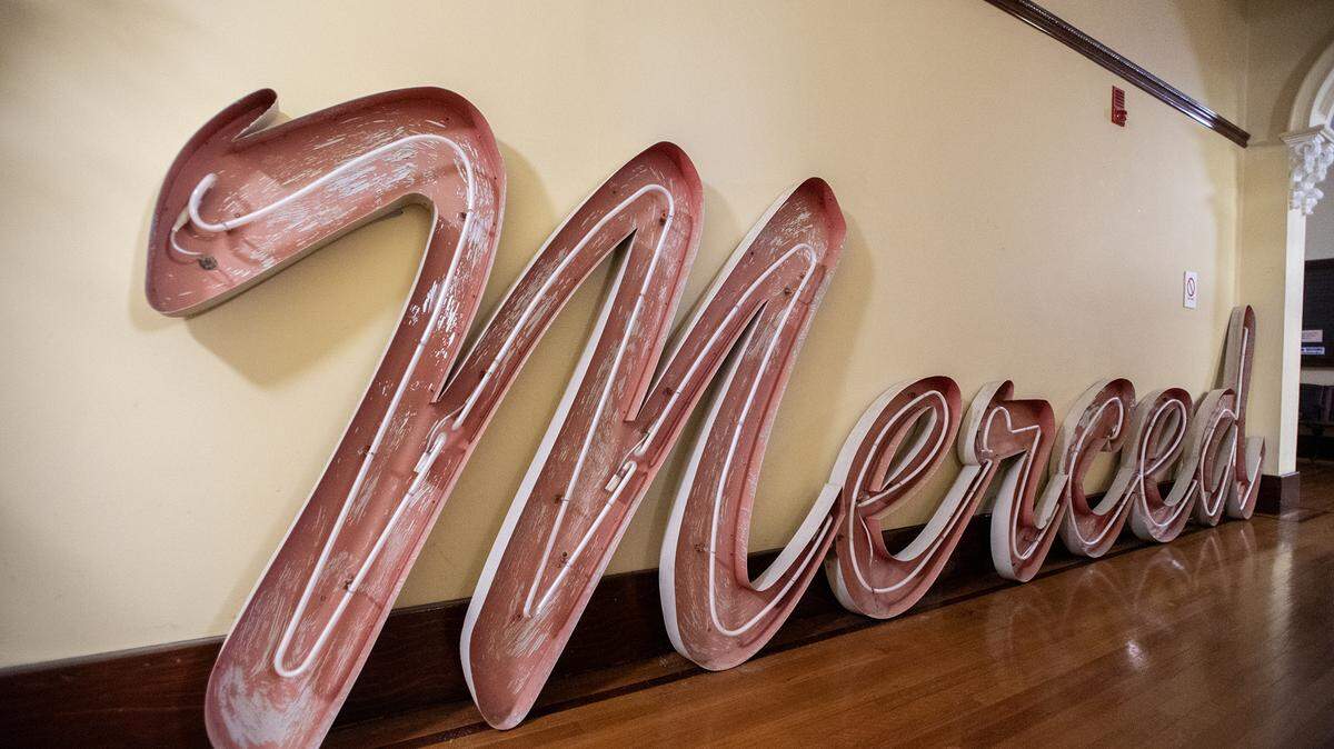 The former Merced Mall neon sign sits on the ground floor of the Merced County Courthouse Museum in Merced, Calif., on Friday, Aug. 1, 2025. The sign was removed from one of the mall’s entrances in July. 