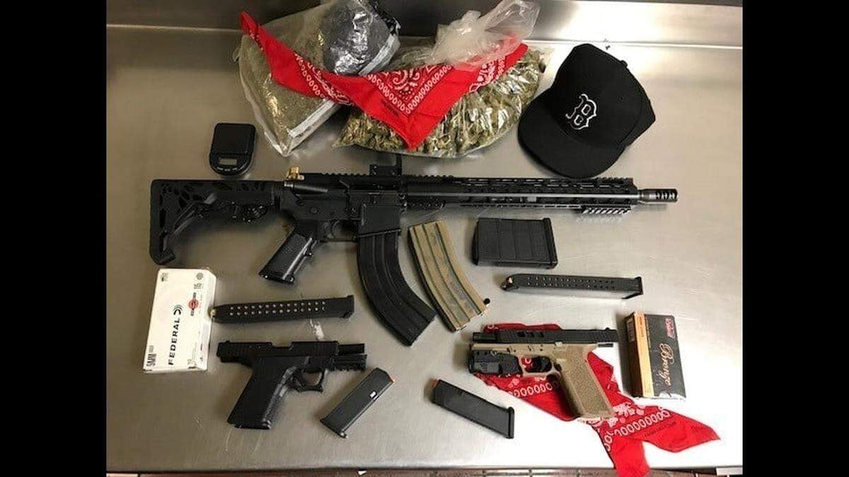 Four teenagers from Merced and Atwater were arrested on Friday morning after police located these firearms, ammunition and gang paraphernalia in their vehicle after a traffic stop in Merced.