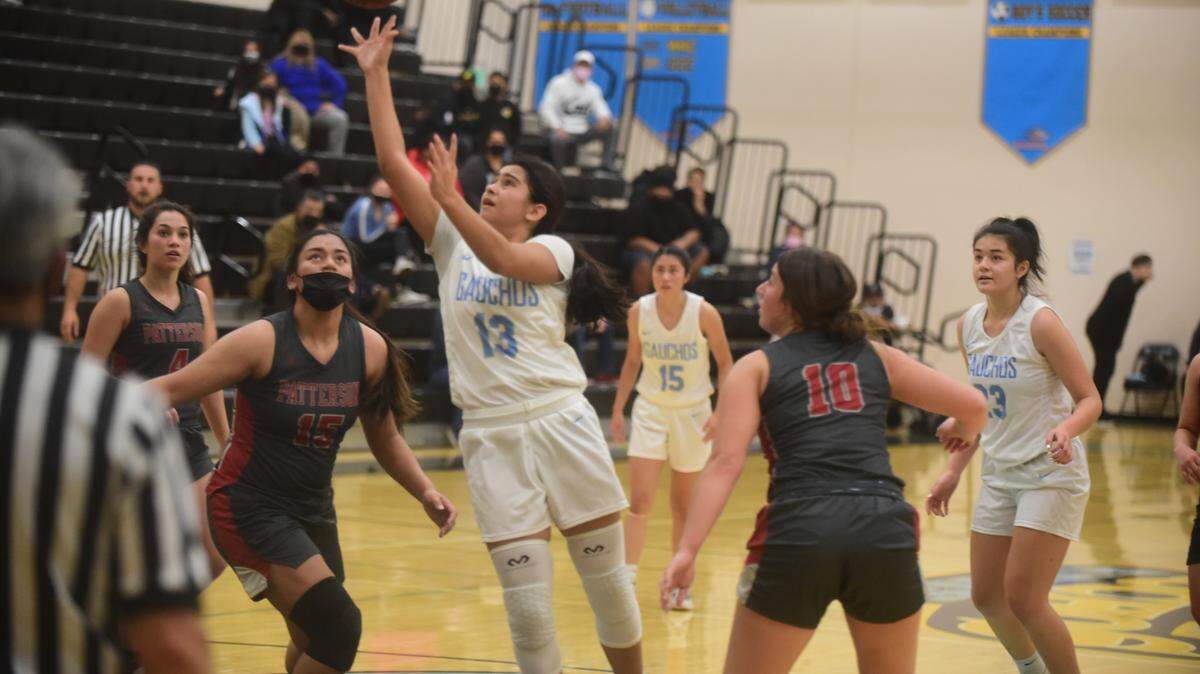 El Capitan High freshman Shantelle Magana (13) goes up for a shot in a game against Patterson on Tuesday, Jan. 11, 2022 at El Capitan High School in Merced, Calif.