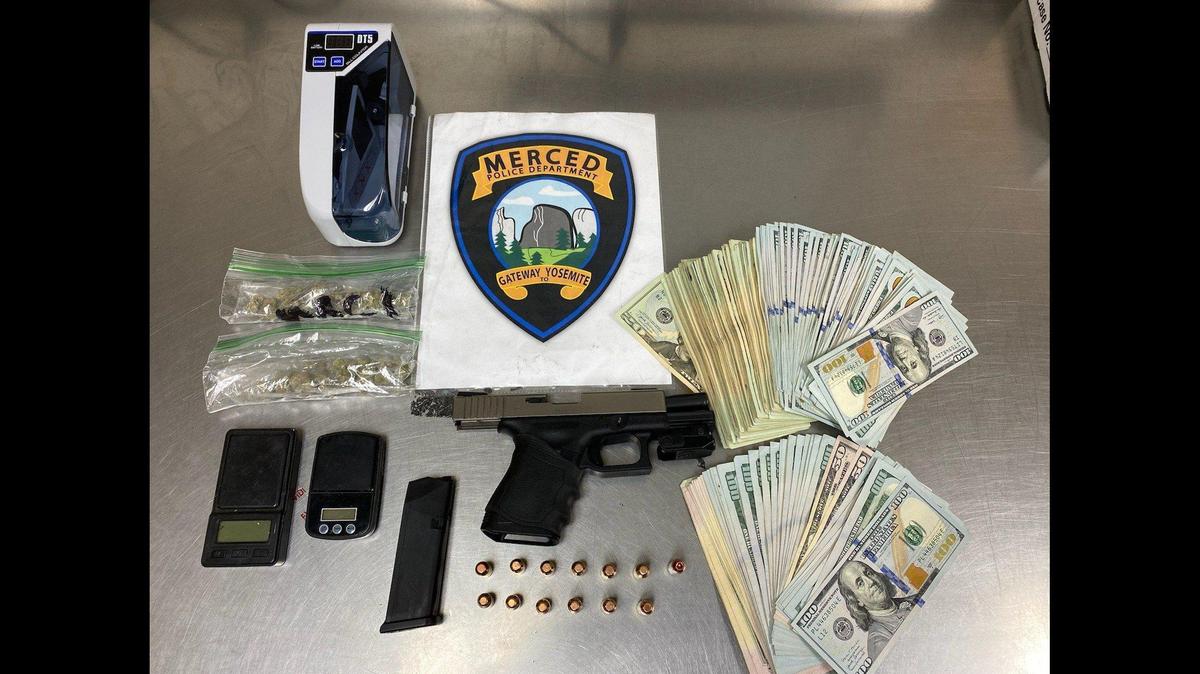 Police are investigating after the arrest of a suspected gang member found with a gun, cash and items related to narcotics sales in Merced on Saturday, according to the Merced Police Department. Image courtesy of Merced Police Department.