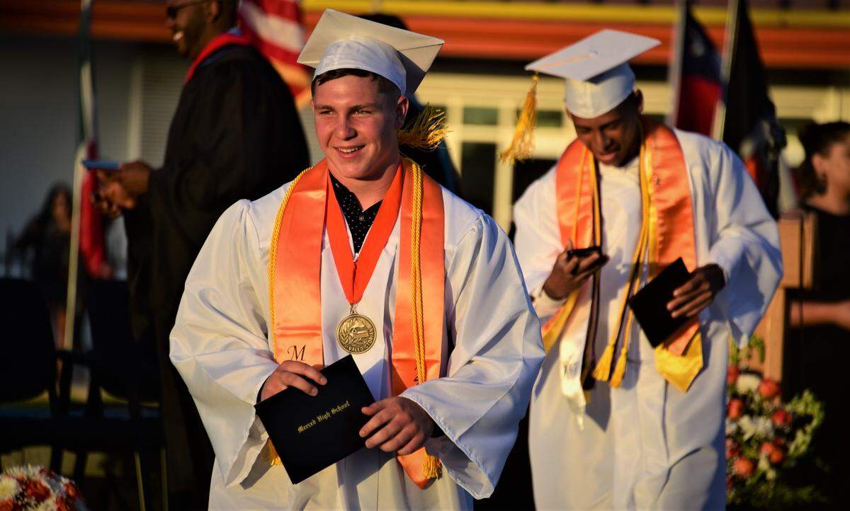 Merced High School senior Seth Scheidt makes his way off stage after receiving his diploma during the school’s graduation ceremony on Thursday, June 2, 2022.