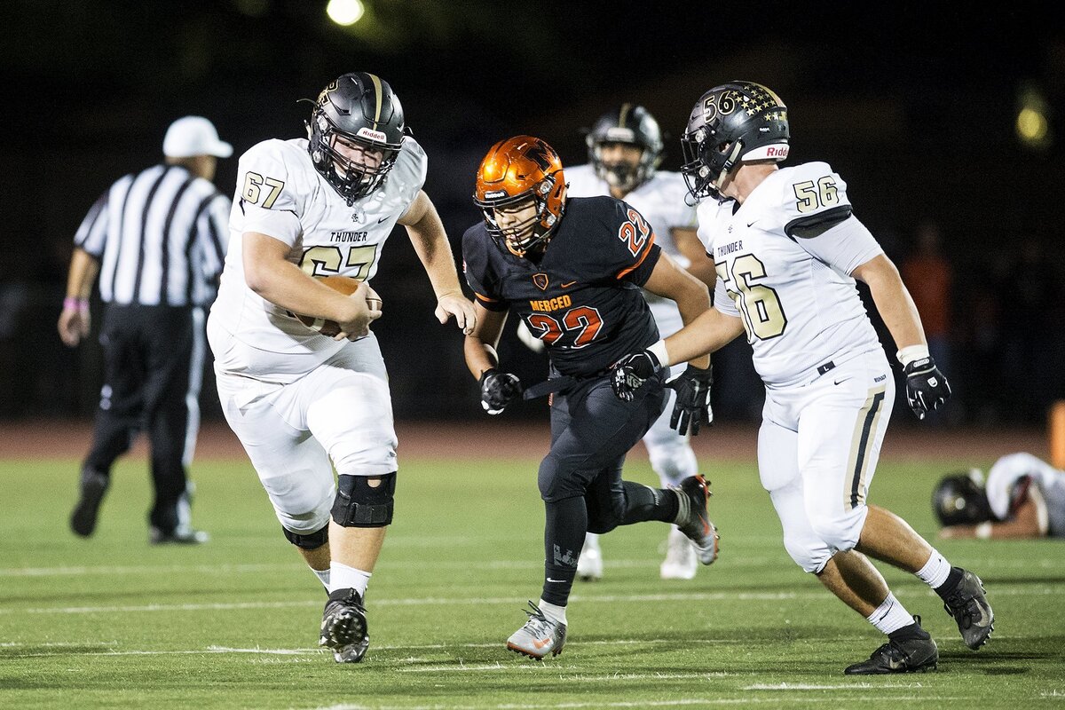 Buhach Colony senior Johnny Lunsford (67) rushes up the field after catching a pass during a game against Merced at Veterans Stadium in Merced, Calif., on Friday, Oct. 5, 2018. The Bears beat the Thunder 55-14.