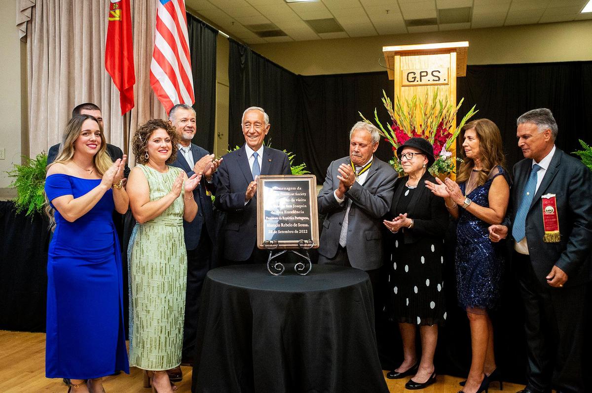 Portugal President Marcelo Rebelo de Sousa unveils a plaque with members of the community during his visit to Gustine, Calif., on Sunday, Sept. 25, 2022.