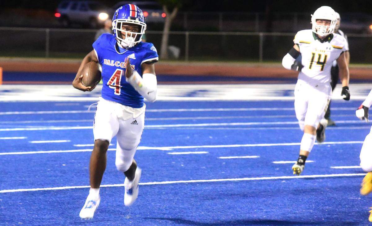 Atwater High quarterback AJ Banks runs the ball up field during a game against Hilmar on Friday, Sept. 13, 2024 at Dave Honey Stadium.