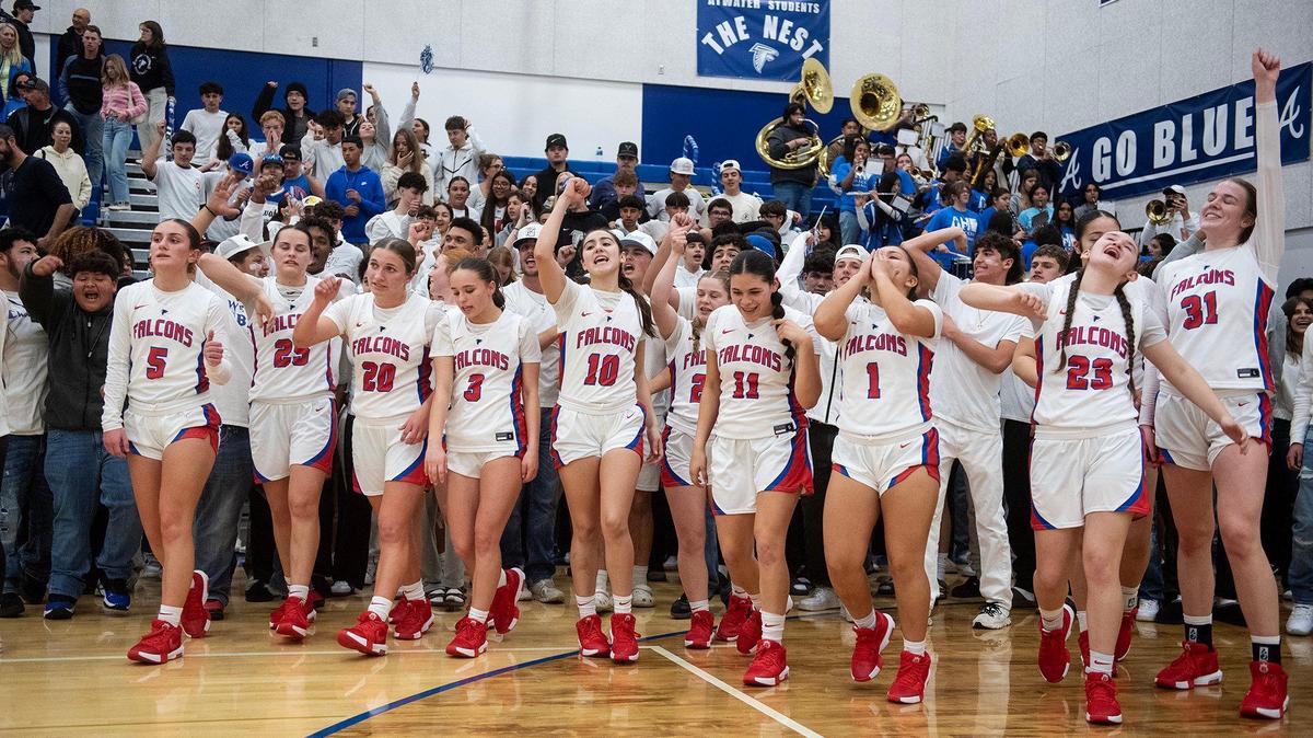The Atwater Falcons celebrate a 58-39 win over the Valley Christian Warriors following a CIF NorCal Division II playoff game at Atwater High School in Atwater, Calif., on Tuesday, March 4, 2025.