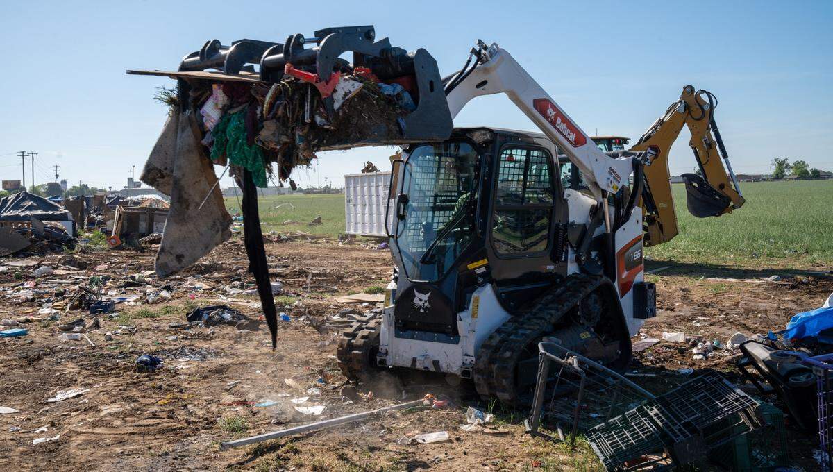 Merced County officials partnered with other local agencies to tear down a large homeless encampment located near East Childs Ave. and Highway 99 this week in Merced.