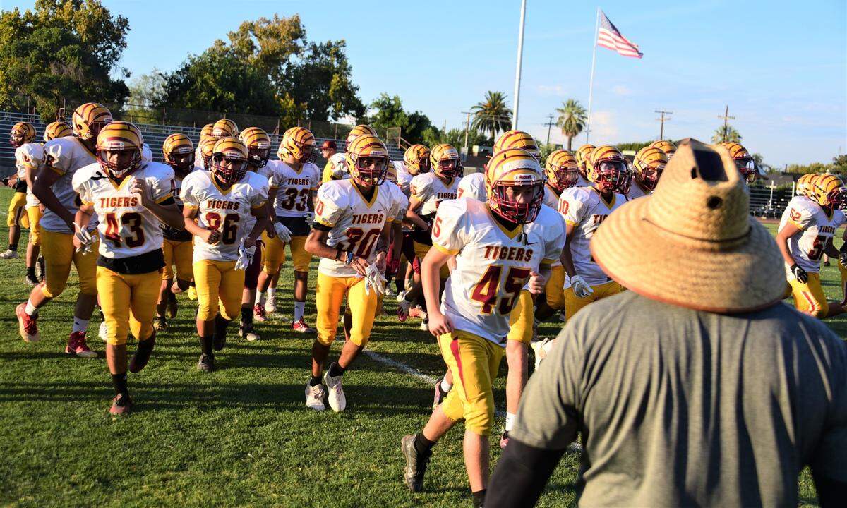 The Los Banos High School football team practices on Wednesday, Aug. 3, 2022 at Loftin Stadium in Los Banos, Calif.