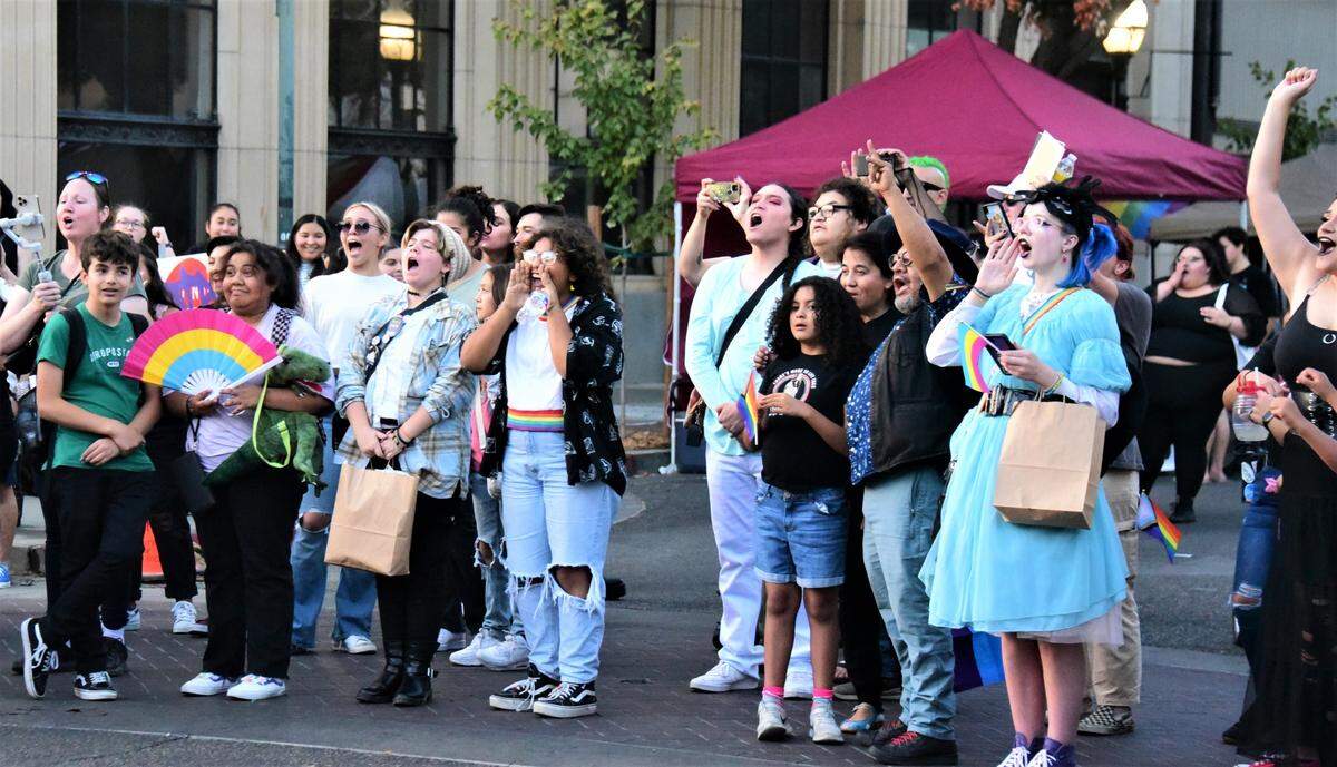 People gather in front of Bob Hart Square in Downtown Merced to watch the performers during Merced Pride Fest on Saturday, Sept. 17, 2022.