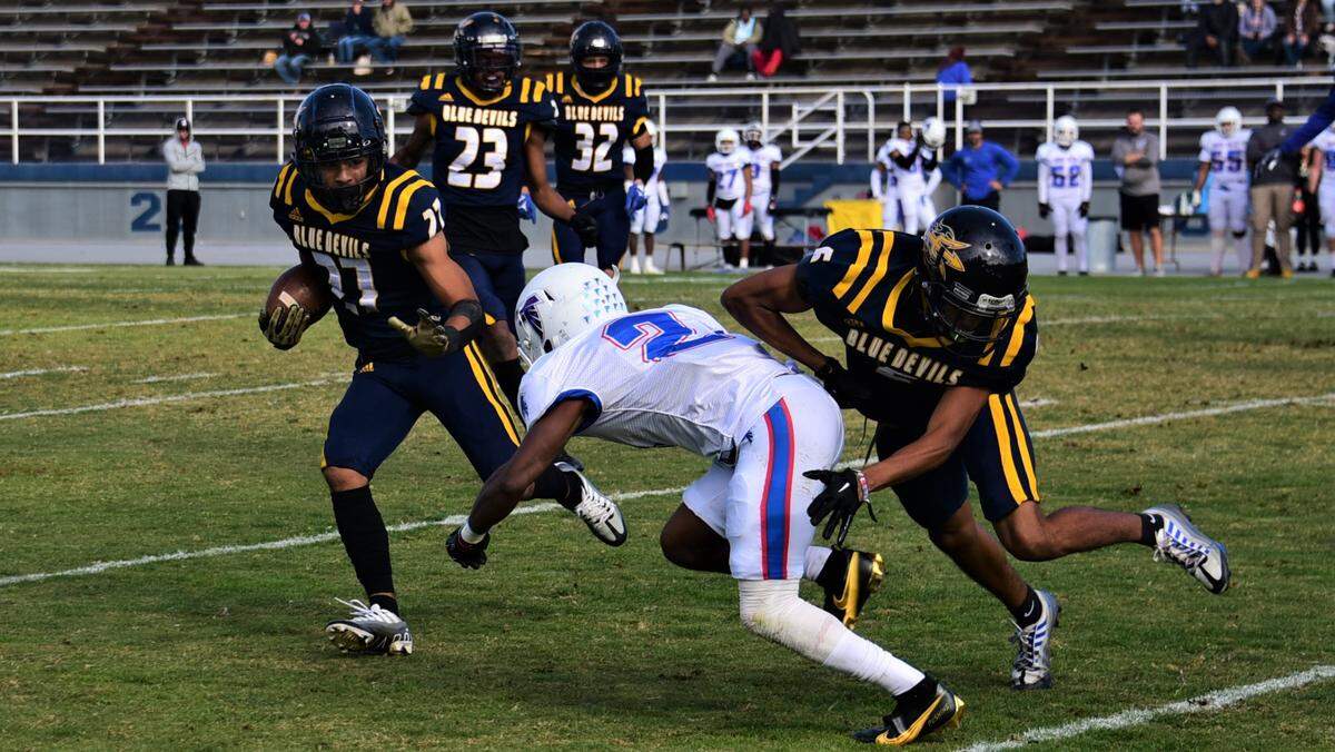Merced College safety Amare Padilla (27) returns an interception in the first half of a 41-14 win over West Hills Coalinga on Saturday, Nov. 12, 2022 at Stadium ’76.