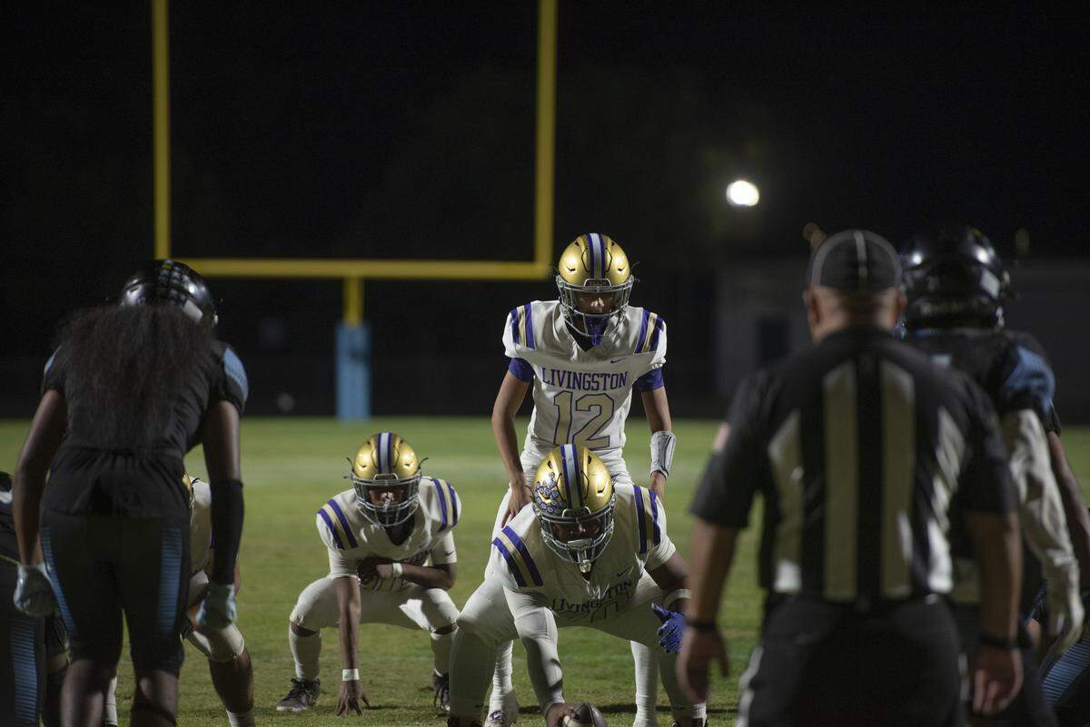 Livingston quarterback Roman Gonzalez lines up under center during the Wolves’ 22-8 loss to El Capitan in Friday’s CIF Sac-Joaquin Section Bowl at Stadium 76 in Merced.