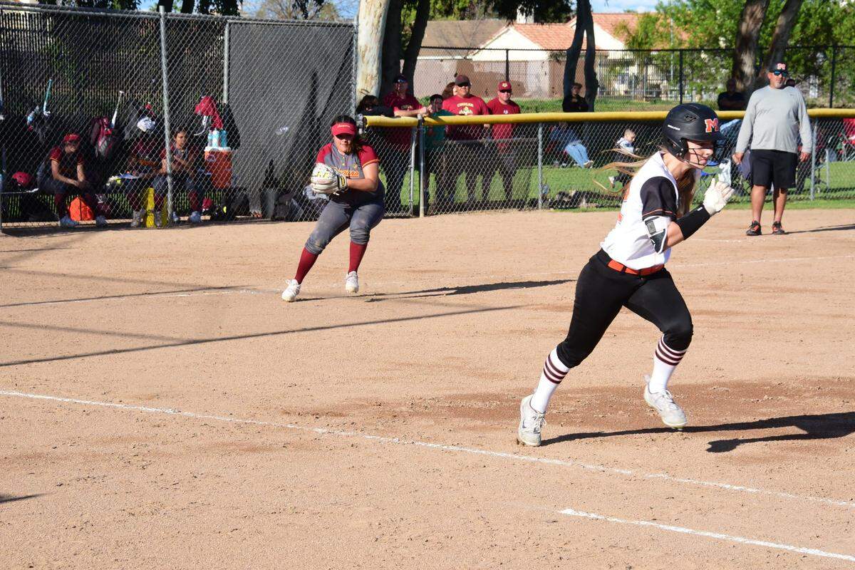 Golden Valley third baseman Maddie Martinez fields a bunt and throws out Merced senior Ashlynn Chatham during the Cougars’ 7-2 win over the Bears on Friday, April 5, 2019 at Merced High in Merced, Calif.
