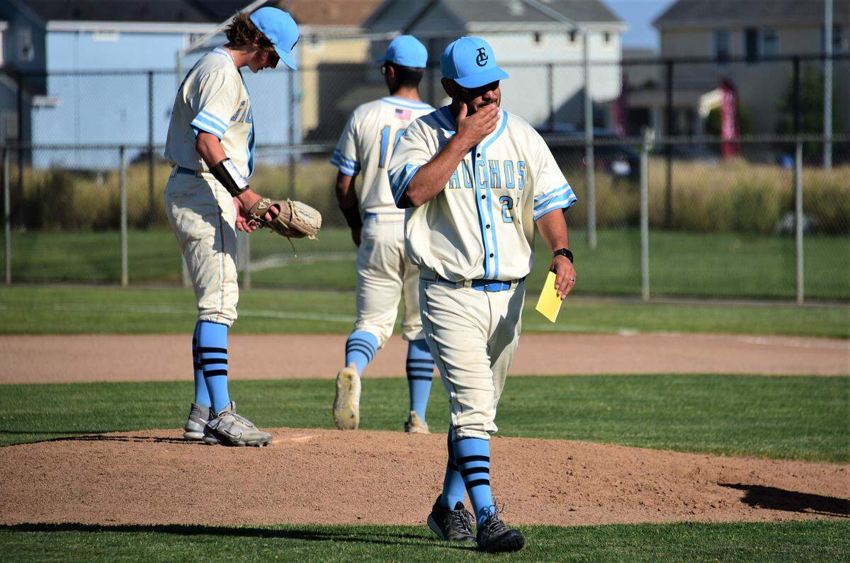 El Capitan High School baseball coach Aaron Ruiz leaves the field after a visit to the mound during a 9-2 playoff loss to Granite Bay on Thursday, May 11, 2023.