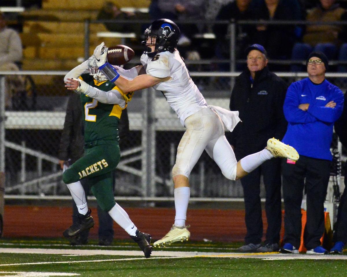 Ripon Christian receiver Sean McGovern reaches out to make a catch over a Hilmar defender during the Division VI CIF Sac-Joaquin championship game between Ripon Christian and Hilmar at Turlock High School in Turlock CA on November 30, 2018.
