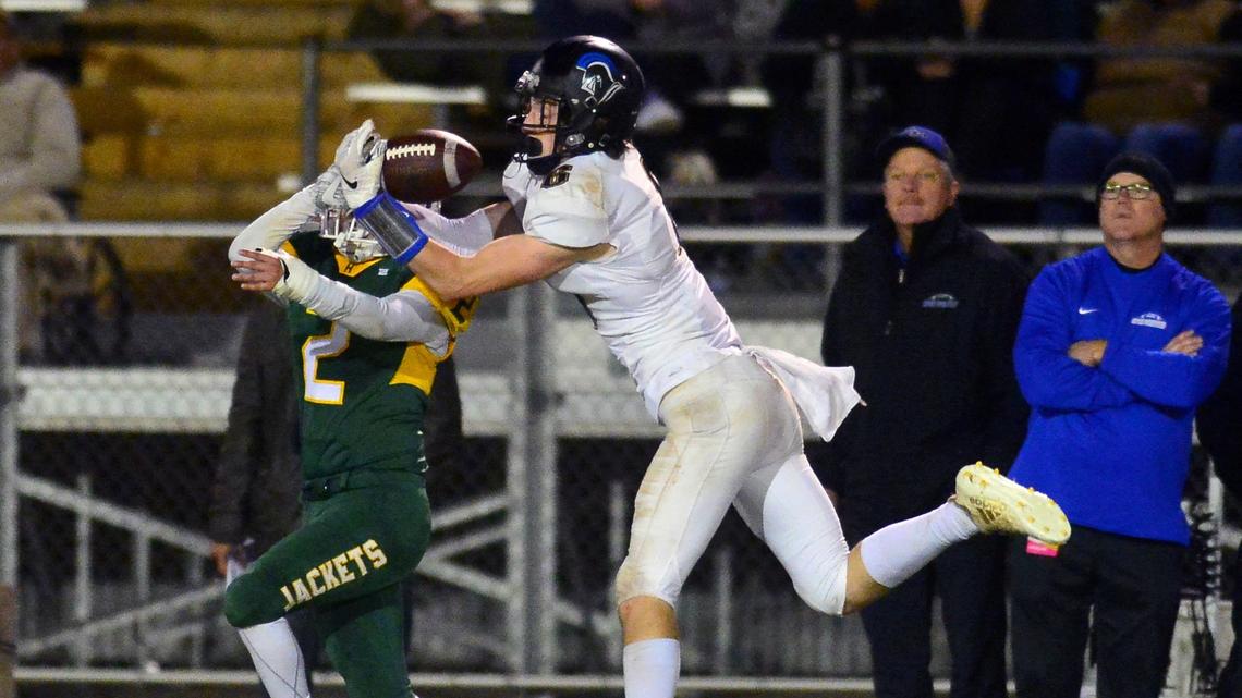 Ripon Christian receiver Sean McGovern reaches out to make a catch over a Hilmar defender during the Division VI CIF Sac-Joaquin championship game between Ripon Christian and Hilmar at Turlock High School in Turlock CA on November 30, 2018.