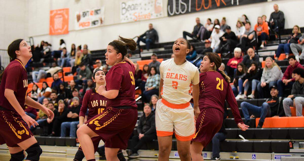 Merced High senior Amari Stamps watches a floater go in for a basket during a playoff game against Los Banos on Tuesday, Feb. 18, 2020 at Merced High School.