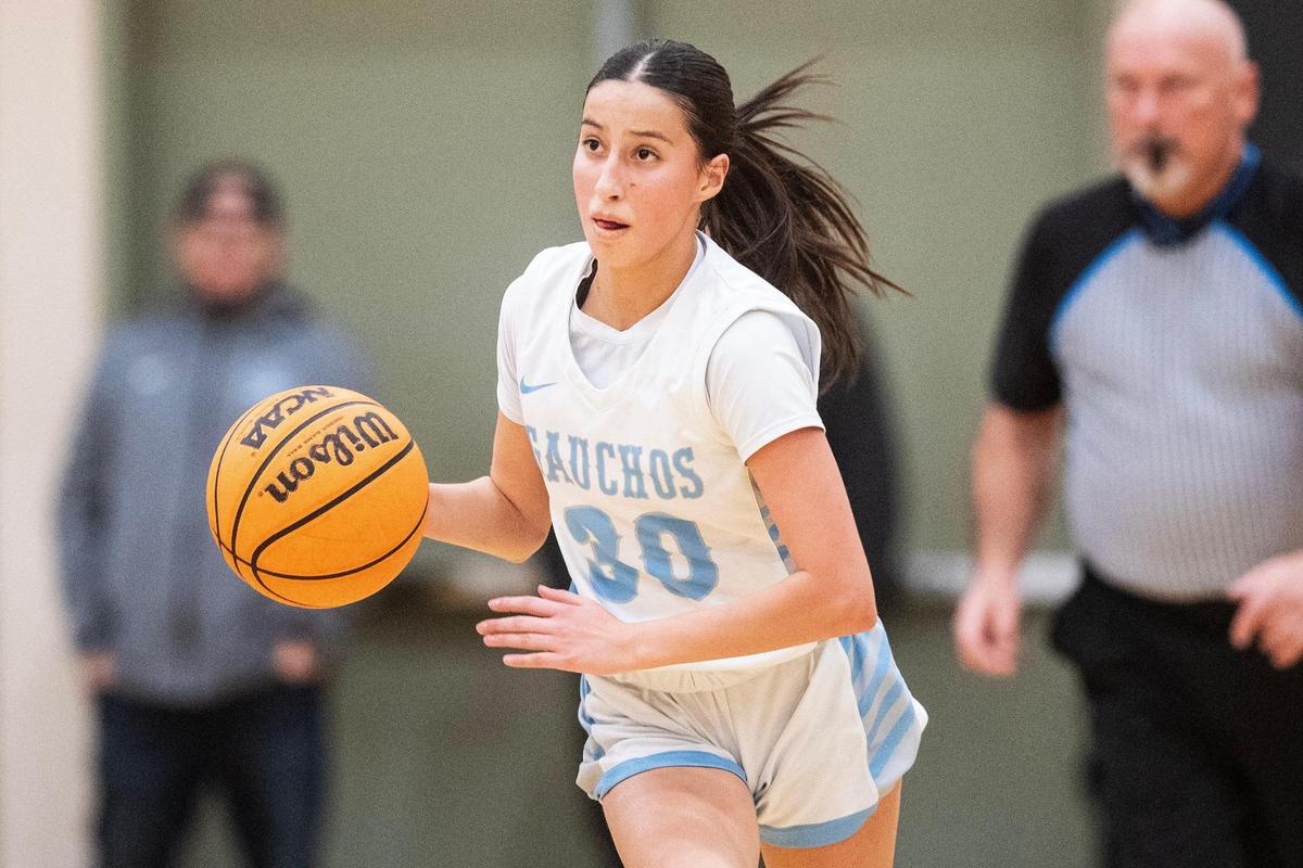 El Capitan freshman Alexis Valenzuela (30) dribbles up the court during a game against Atwater at El Capitan High School in Merced, Calif., on Thursday, Feb. 6, 2025. The Gauchos beat the Falcons 57-47.