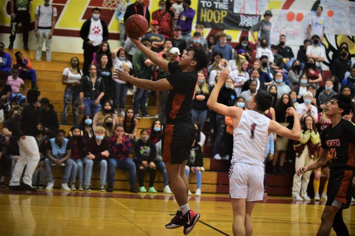 Merced High senior Jaylen Thao-Booth goes up for a layup during a game against Golden Valley at Cougar Arena on Friday, Feb. 11, 2022.