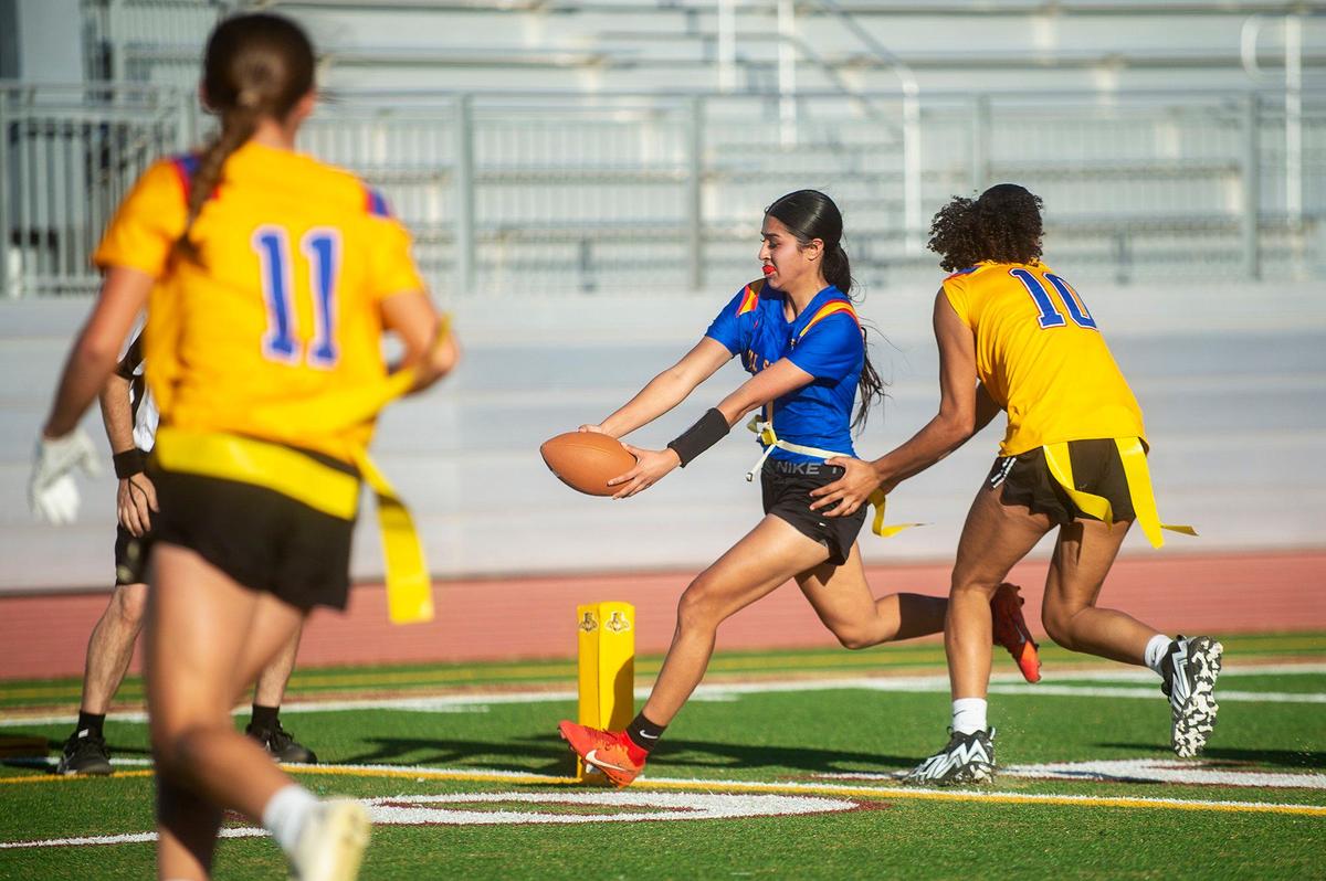 Blue All-Star Marissa Renteria (1) representing Ceres, stretches the ball across the goal line for a touchdown during the Merced County All-Star Girls Flag Football Game at Golden Valley High School in Merced, Calif., on Saturday, June 15, 2024. The Blue All-Stars beat the Gold All-Stars 20-12.