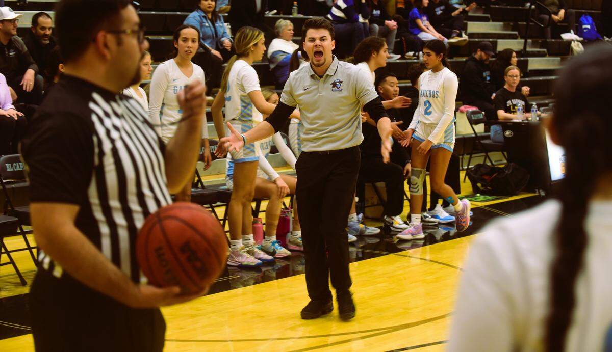 El Capitan High School girls basketball coach Tyler Dietz questions a call by the officials during a game against Atwater on Tuesday, Jan. 16, 2024.