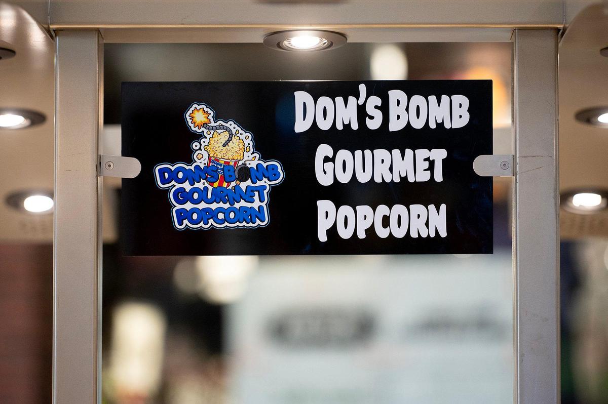 A grand opening is held for Dom’s Bomb Gourmet Popcorn inside the Marketplace at Merced in Merced, Calif., on Thursday, May 1, 2025. The kiosk offers unique gourmet popcorn flavors created by the business’ owner and Merced resident Dominique Pruitt.