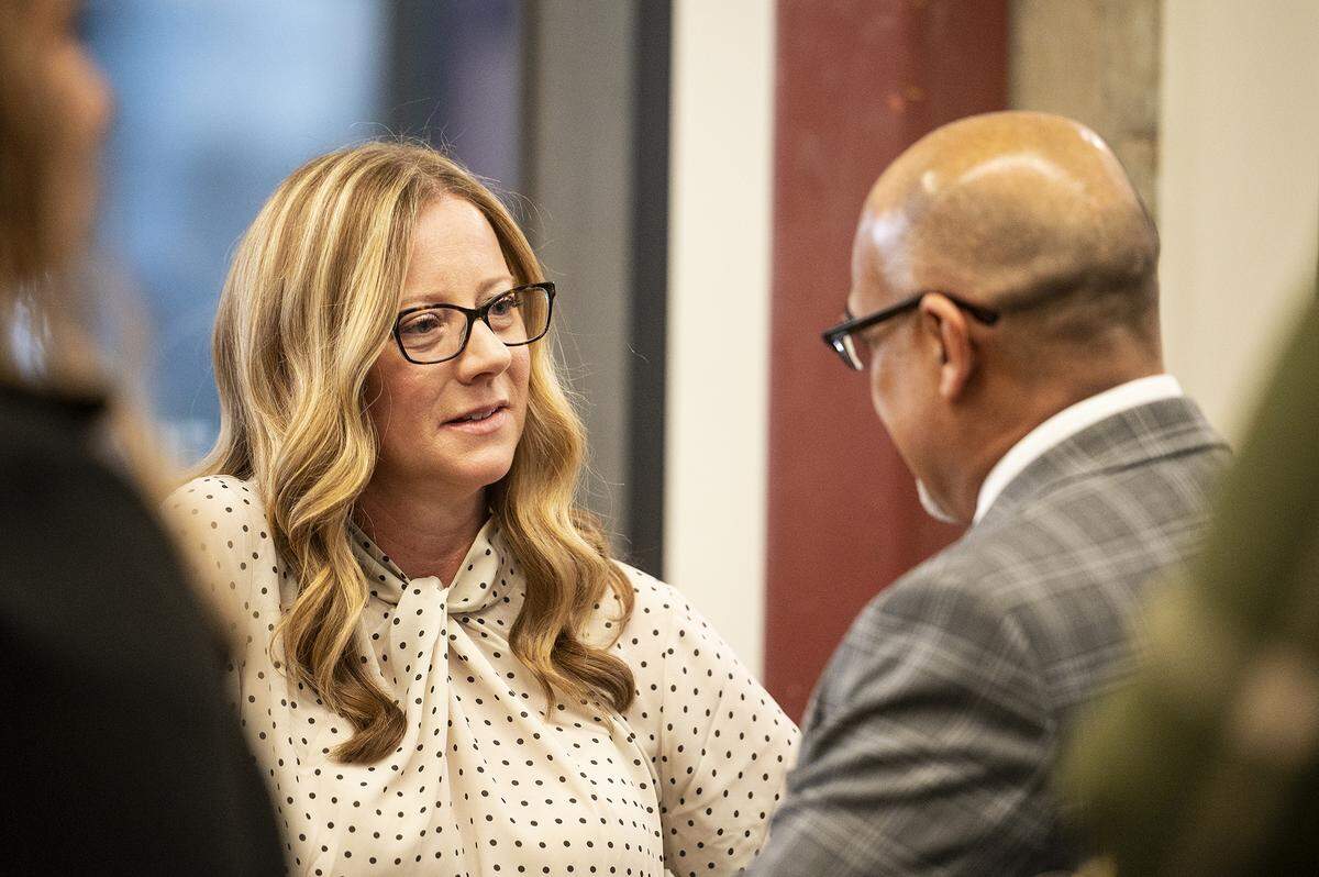 Community Foundation of Merced County Executive Director Stephanie Dietz, left, speaks with those in attendance following a ceremony in Merced, Calif., on Wednesday, Jan. 3, 2024. Dietz previously served as Merced city manager.