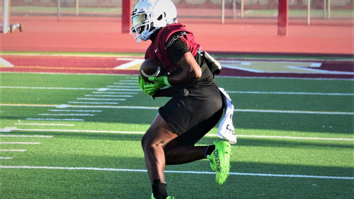 Golden Valley High School senior Jonah White hauls in a pass during practice on Tuesday, Aug. 15, 2023 at Veteran Stadium in Merced, Calif.