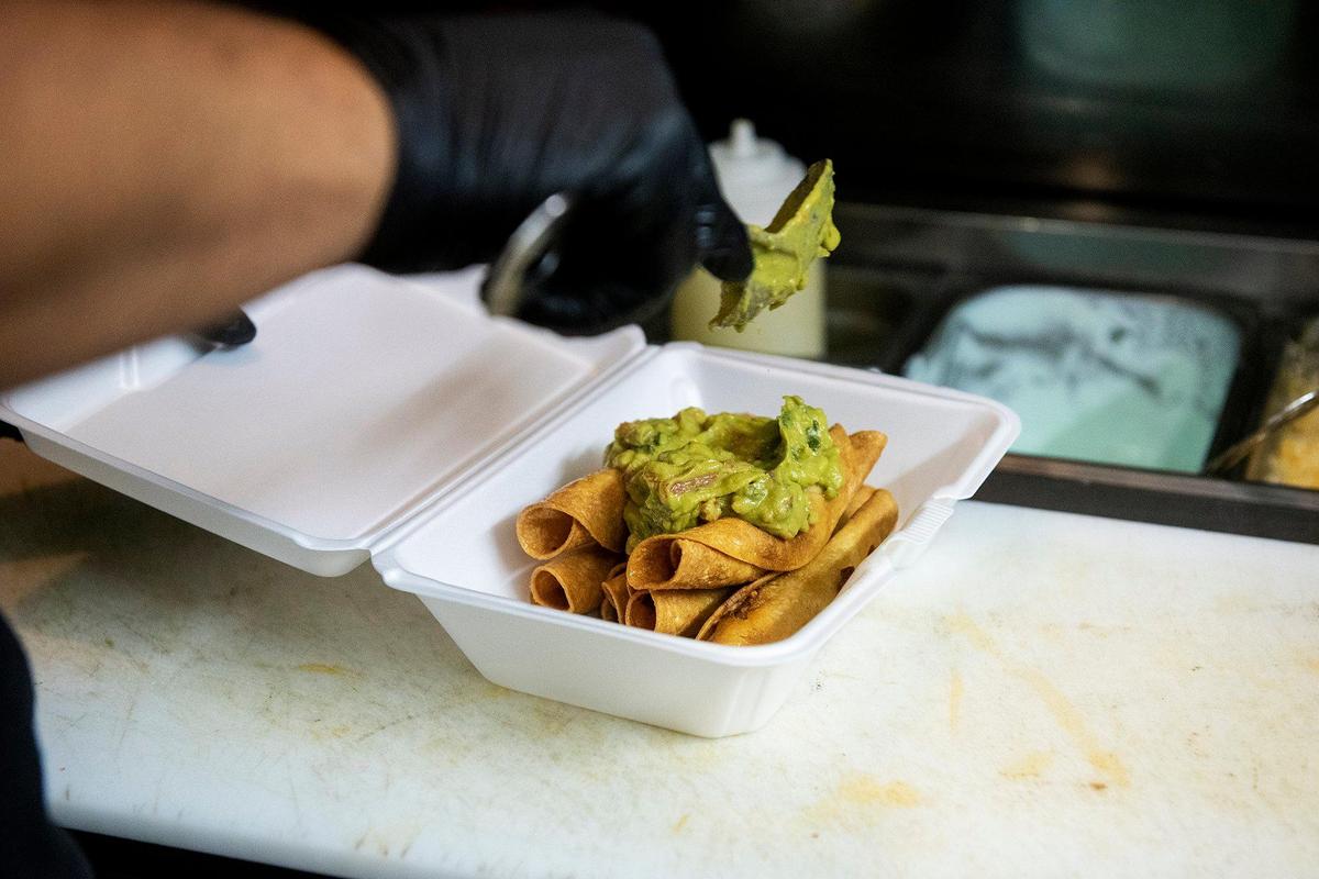 Chayanne Valencia, 33, prepares an order of rolled tacos at Maria’s Taco Shop in Merced, Calif., on Tuesday, Oct. 15, 2024. The restaurant which is open 24 hours, has offered authentic fast Mexican food to the Merced community for 32 years.