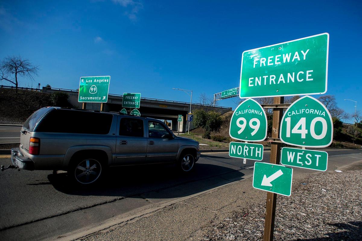 A motorist drives up the Highway 99 North on-ramp in Merced, Calif., on Friday, Feb. 22, 2019.