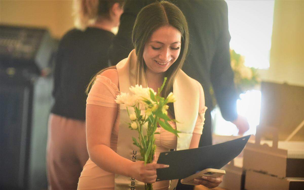 UC Merced student Elizabeth Meza Torres smiles during a celebration recognizing UC Merced undocumented students who are graduating this weekend on Friday, May 13, 2022 at UC Merced in Merced, Calif.