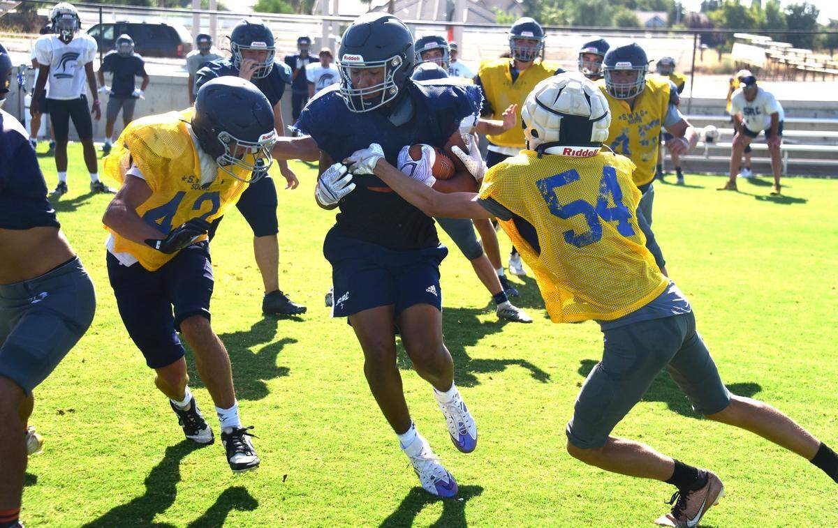 Stone Ridge Christian junior Daijon O’Neil runs the ball during practice on Wednesday, Aug. 7, 2024.