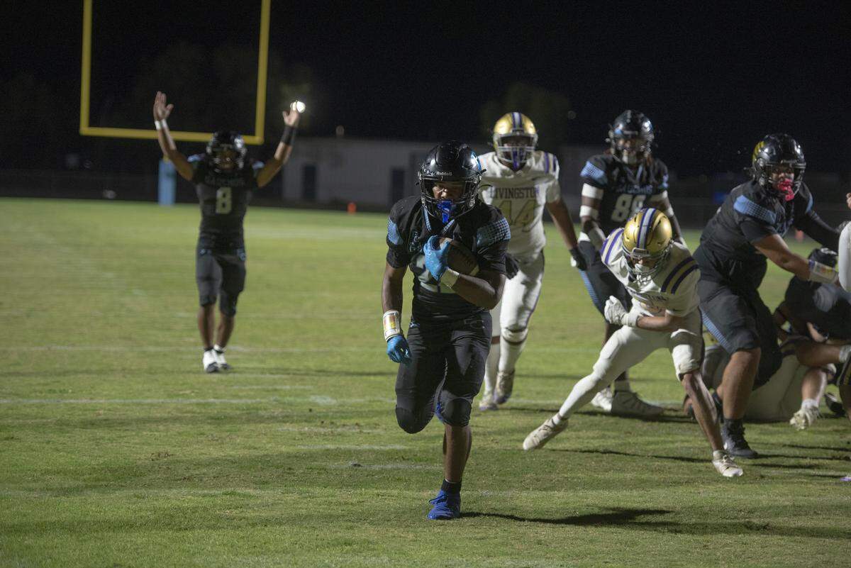 El Capitan senior running back Lorenzo Peters breaks free for a touchdown run during Friday night’s 22-8 win over Livingston in the CIF Sac-Joaquin Section Bowl at Stadium 76 in Merced. Peters scored twice and returned an interception for a touchdown.