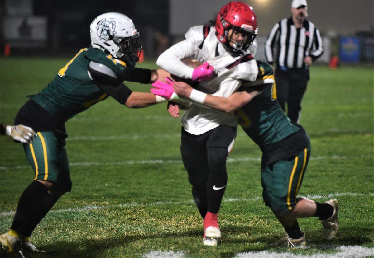 Woodland Christian senior Billy Hinkle runs against Le Grand during the Cardinals’ 44-0 win over the Bulldogs in the Sac-Joaquin Section Division VII semifinals on Friday, Nov. 18, 2022 at Le Grand High School.