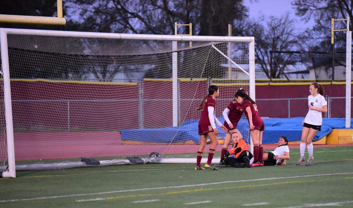 Golden Valley junior Jadyn Gong saves a shot from Merced’s Jocelyn Mejia during a game on Thursday, Feb. 13, 2020 at Veterans Stadium.