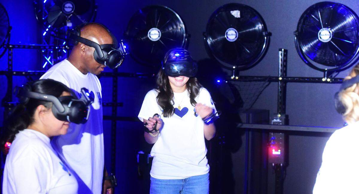 Merced College unveiled the first virtual reality learning facility at a California community college to deploy both a Dreamscape Learn classroom and a free-roam pod experience. Here community members are enjoying the free-roam pod experience on Friday, Aug. 9, 2024.