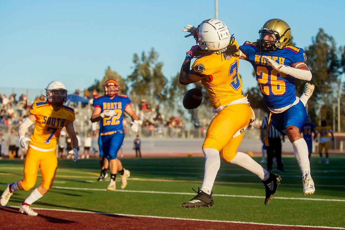 North All-Star Marcello Avalos (26) representing Buhach Colony, breaks up a pass intended for South All-Star Jonah White (3) representing Golden Valley, during the Merced County All-Star Football Game at Golden Valley High School in Merced, Calif., on Saturday, June 15, 2024. The South All-Stars beat the North All-Stars 33-20.
