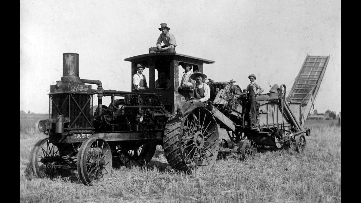 Dos Palos residents Reuel Buerer (left), Noah Van Hook (on top of cab), and Clarence Niles (far right) operated one of the first Case gas tractors in Merced County in 1913. (Courthouse Museum Collection)