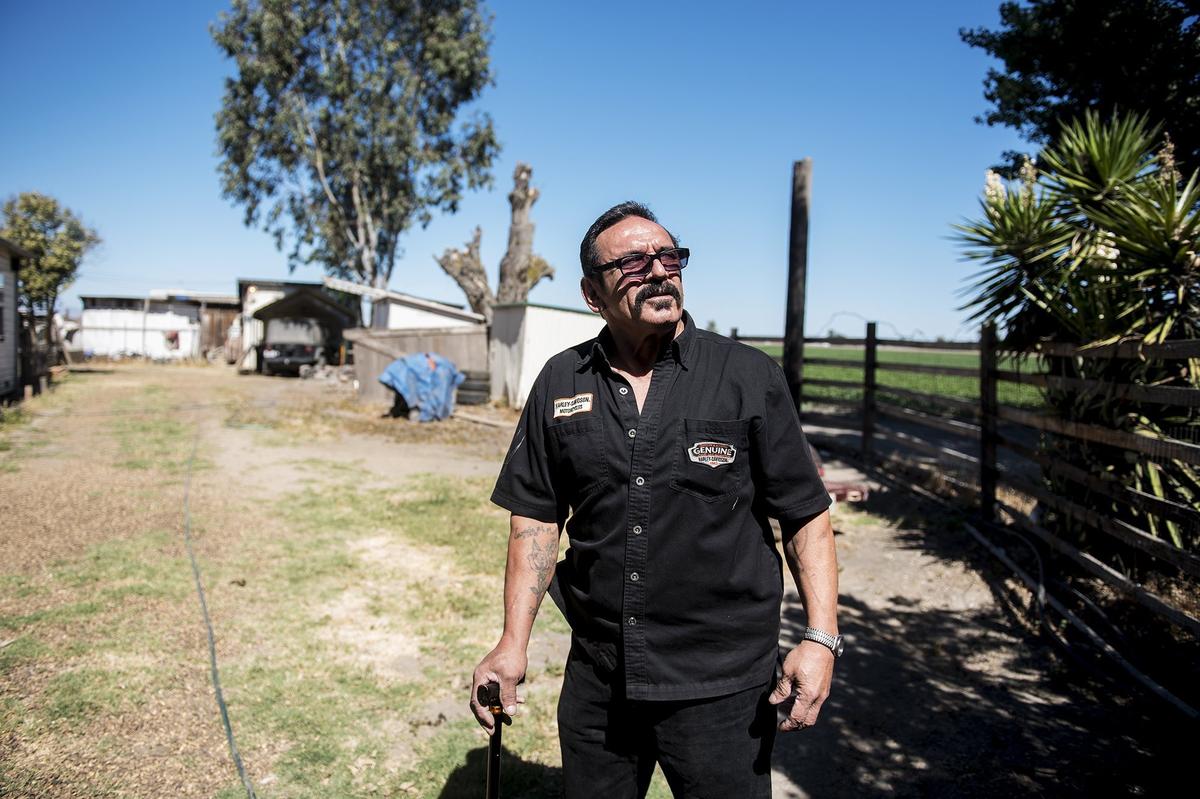 Dos Palos resident George Aguaristi, 61, speaks about how he learned that law enforcement officers killed one of his dogs in May, at his home in Dos Palos, Calif., on Thursday, June 21, 2018. According to Aguaristi, on May 30, 2018, he awoke to a neighbor knocking on his window informing him that law enforcement officers had been on his property. After not being able to find his dog Samson, Aguaristi said he called a phone number on a card that was left on his front door. According to Aguaristi, the number belonged to a district attorney who explained to him that a law enforcement officer had killed his dog Samson after it became aggressive with officers and the dog had been removed from the premises.