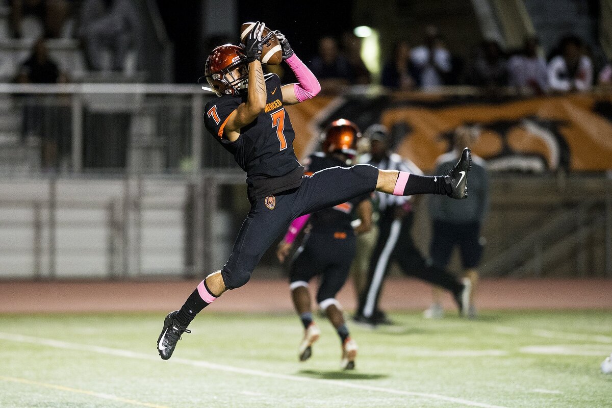 Merced senior Noah Leal (7) leaps to make a catch during a game against Buhach Colony at Veterans Stadium in Merced, Calif., on Friday, Oct. 5, 2018. The Bears beat the Thunder 55-14.