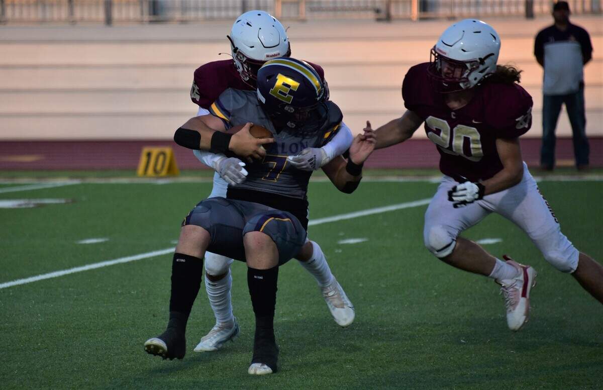 Golden Valley High School senior linebacker Shaun Stover (27) sacks Escalon quarterback Donovan Rozevink (7) during a game on Friday, Aug. 18, 2023 at Veterans Stadium in Merced, Calif.