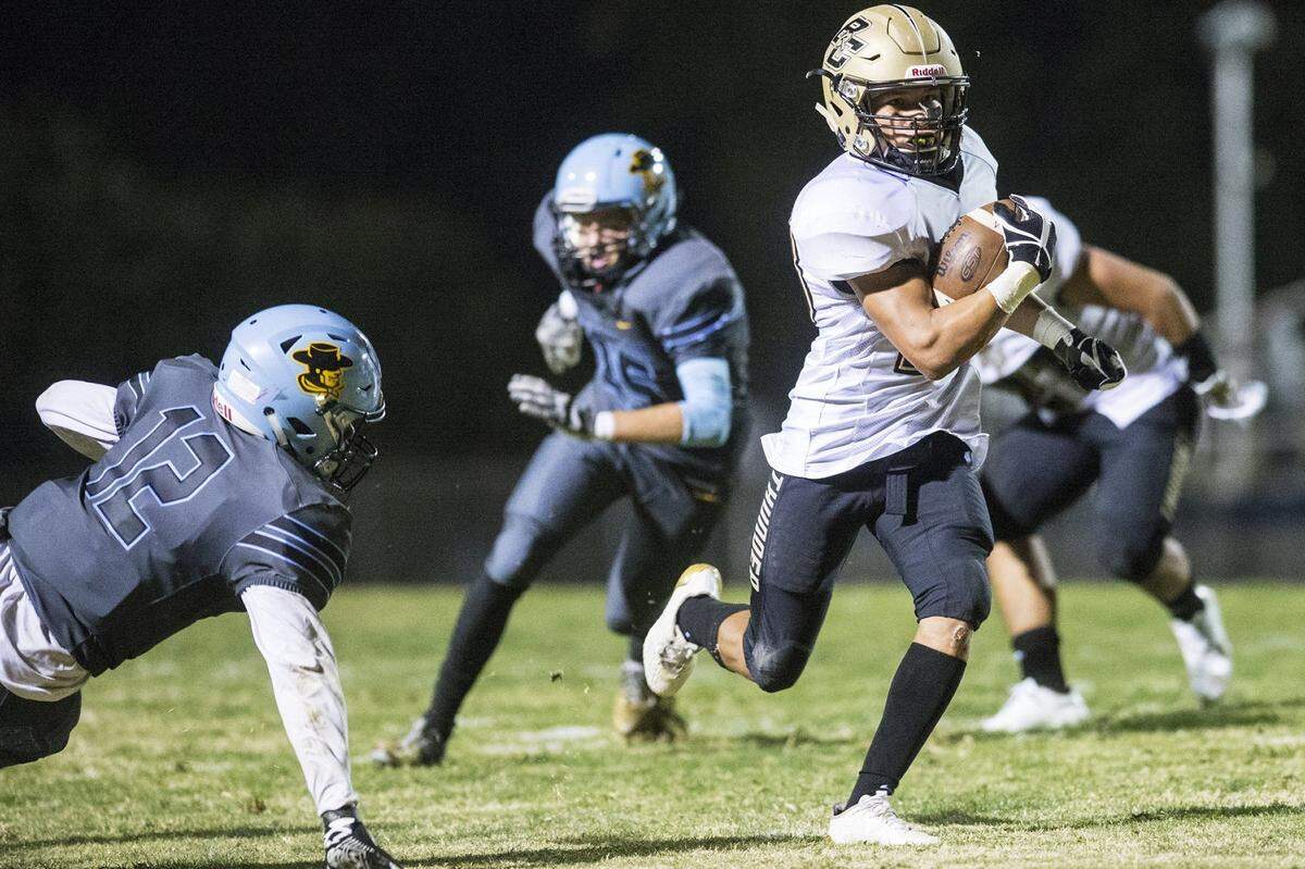 Buhach Colony’s Youlas Dickson III (23) rushes for a Thunder touchdown during a game against El Capitan at Stadium ’76 in Merced, Calif., on Friday, Oct. 6, 2017.  Dickson is second on the team with seven touchdowns this season.
