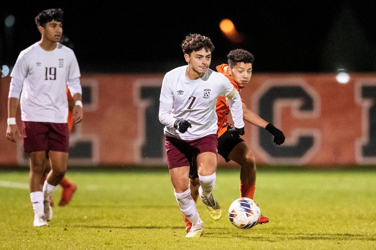 Golden Valley senior Jonathan Gomez (7) moves the ball upfield during a game against Merced at Merced High School in Merced, Calif., on Thursday, Jan. 11, 2024. The Cougars beat the Bears 3-1.