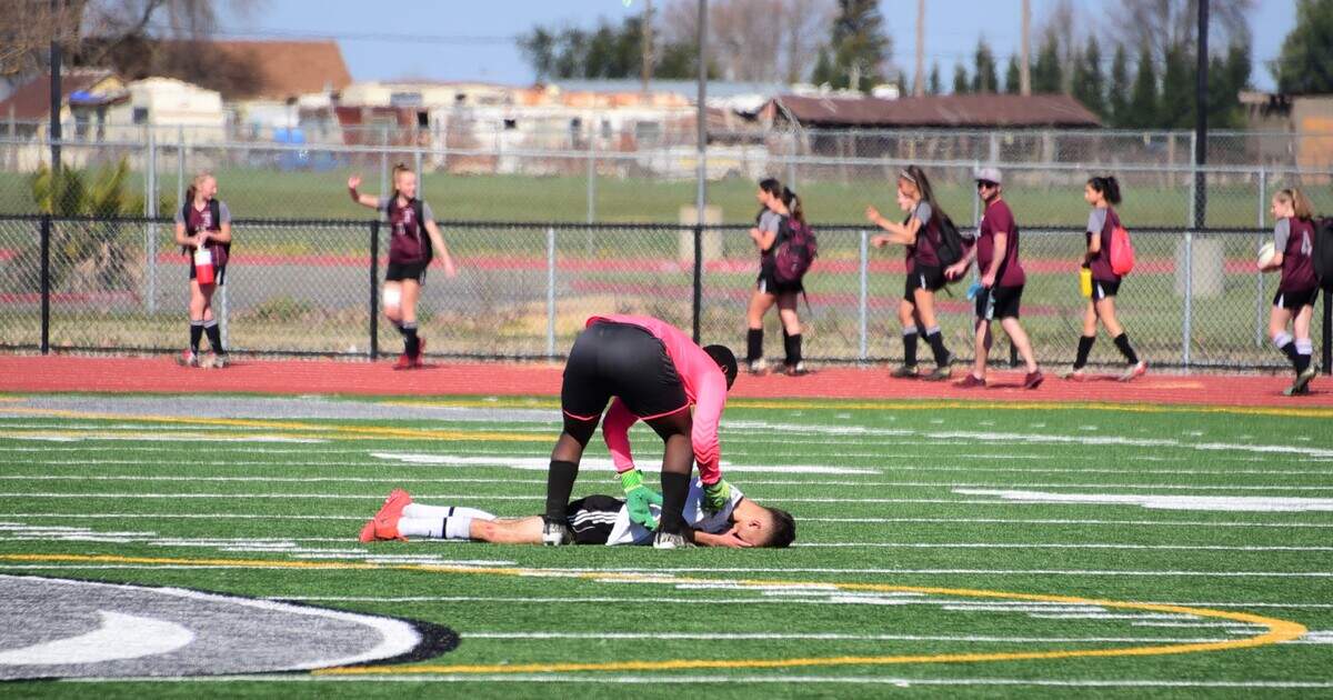Encina goalie Davel Perry attempts to console Le Grand junior Brian Lua affter Encina won the Sac-Joaquin Section Division VI championship at Liberty Ranch HIgh School on Saturday, Feb. 22, 2020 in Galt, Calif.