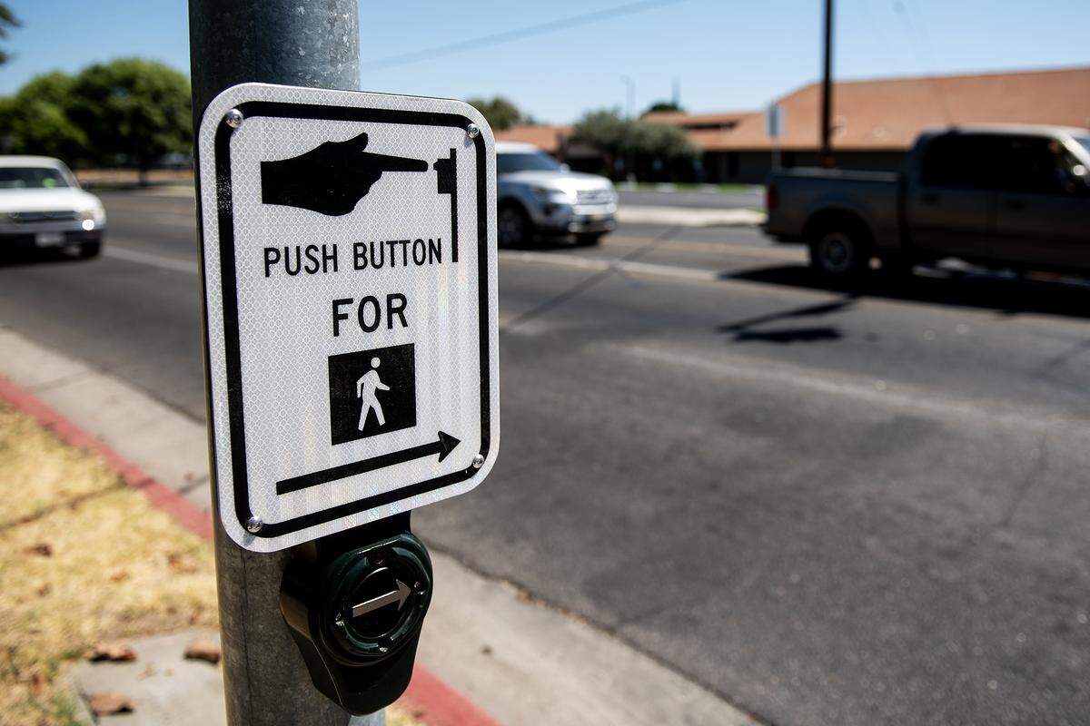 A pedestrian crosswalk button at the intersection of Olive and Parsons avenues in Merced, Calif., on Thursday, July 31, 2025. 