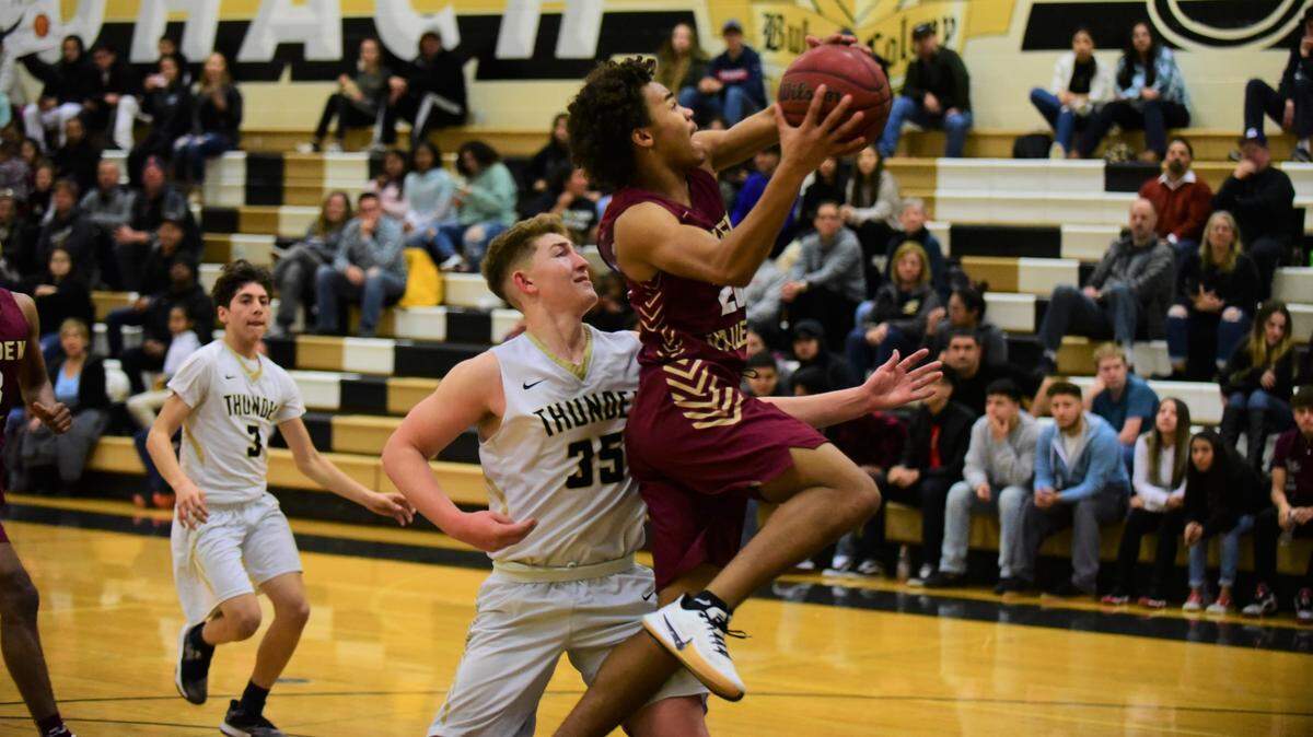 Golden Valley senior Avery Townsel goes up for a layup against Buhach Colony’s Jake Sapien during a game on Friday, Jan. 17, 2020 at Buhach Colony High School.