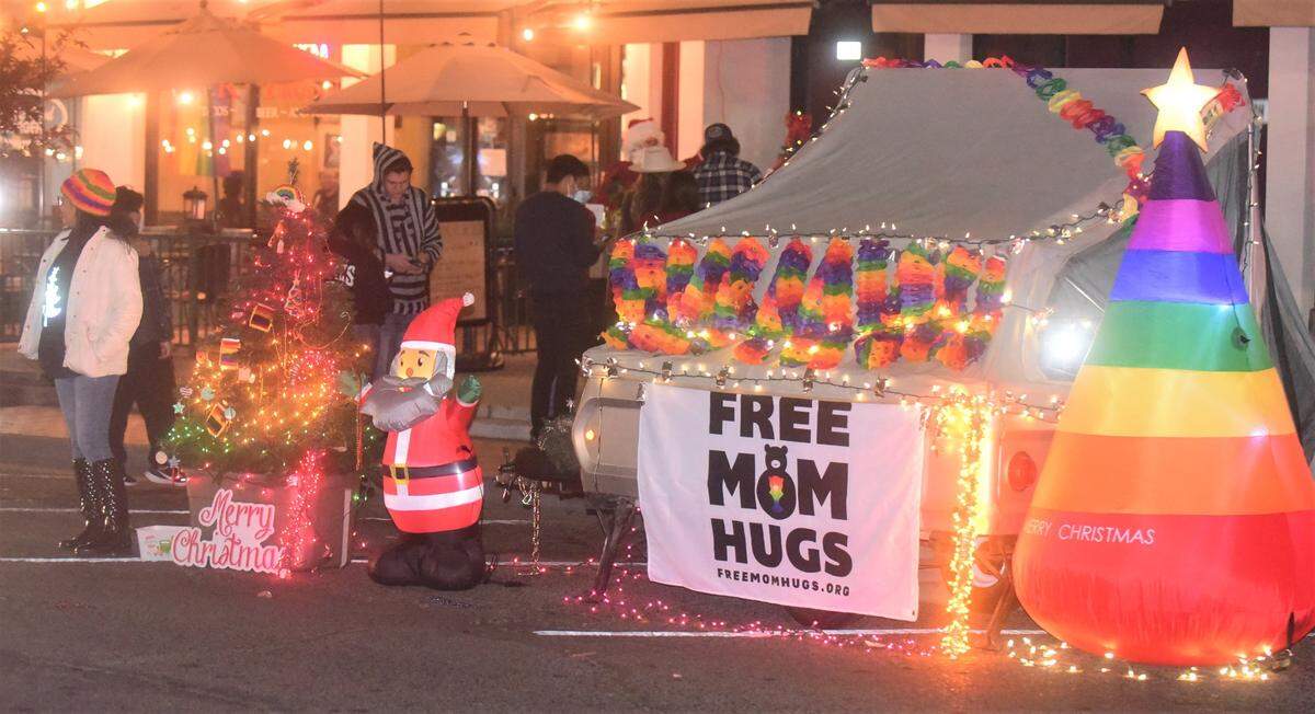 Mom Hugs was one of the many displays and floats lined up on Main Street for Merced’s Christmas Tree Lane “reverse parade” on Saturday, Dec. 4, 2021 in Merced, Calif.