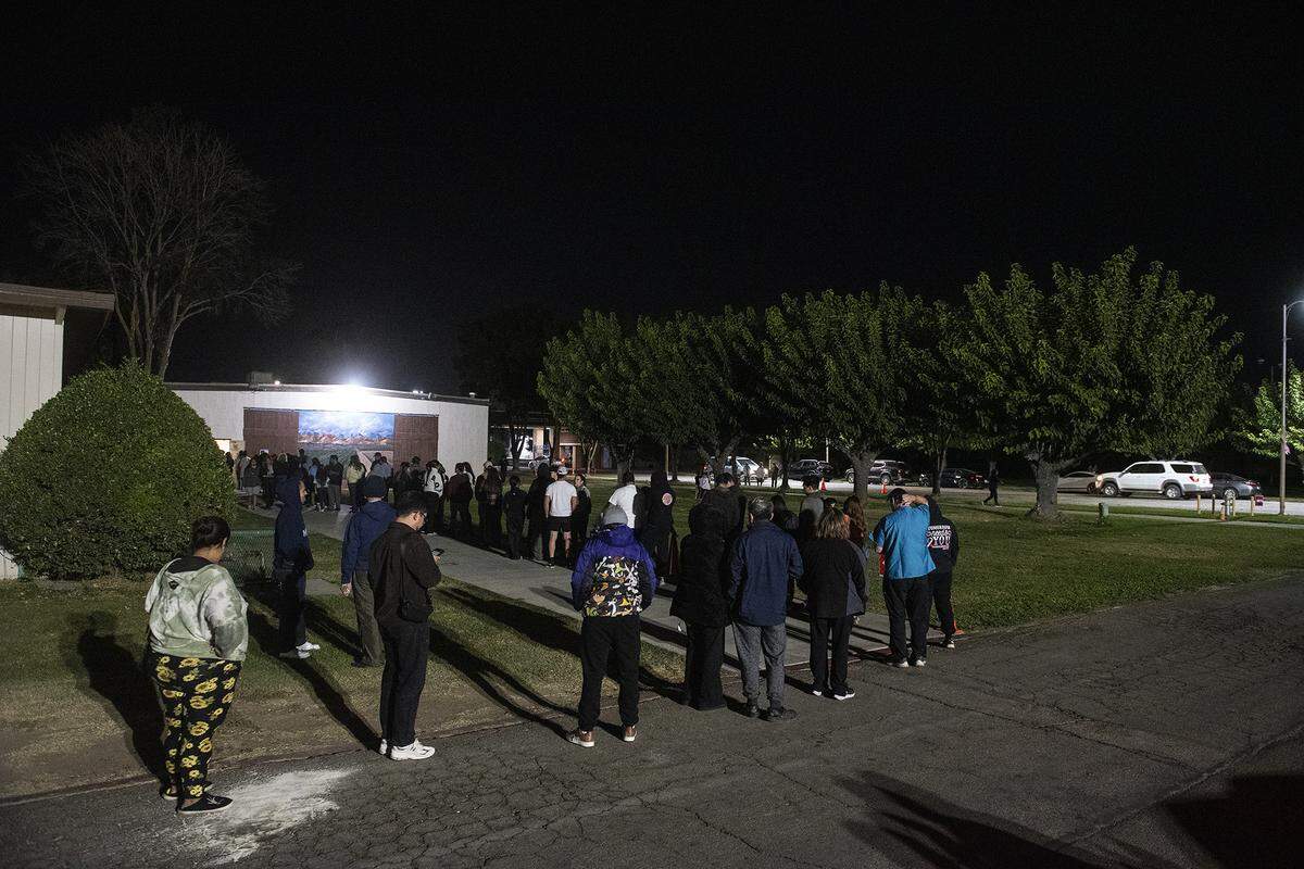 People wait in line to vote at Tioga Hall located at the Merced County Fairgrounds in Merced, Calif., on Tuesday, Nov. 5, 2024.