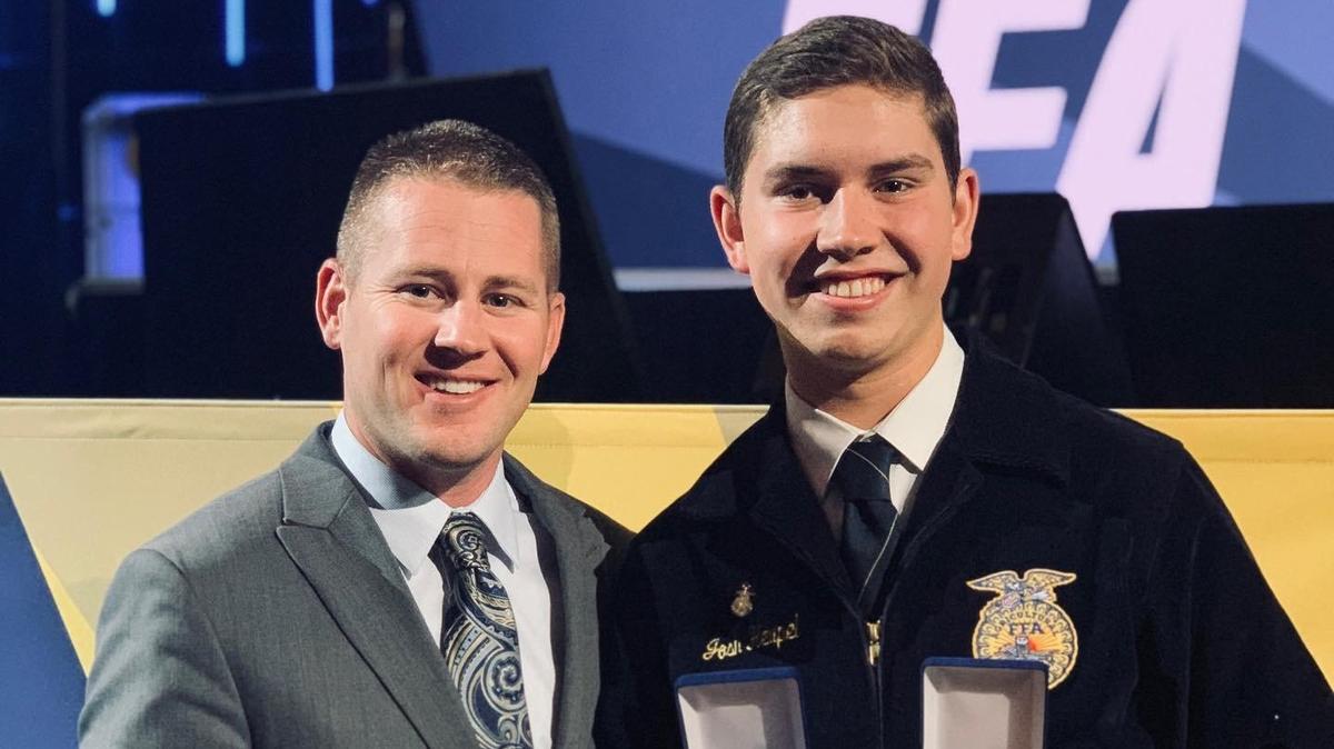 Josh Heupel, right, poses for a photo with Agriculture Instructor Cody Jacobsen, left. Heupel is a recent Golden Valley High School graduate and was named National Proficiency winner in Agricultural Mechanics and Fabrication at the National FFA Convention and Expo. Image courtesy of Golden Valley FAA.